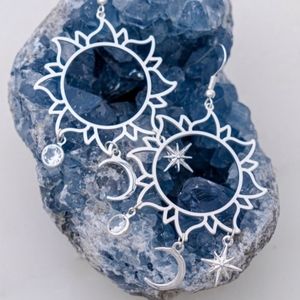 Silver sun,moon and star delicate filigree earrings.